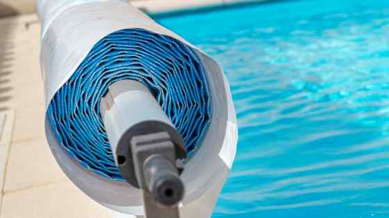 A roll of tarpaulin pool cover